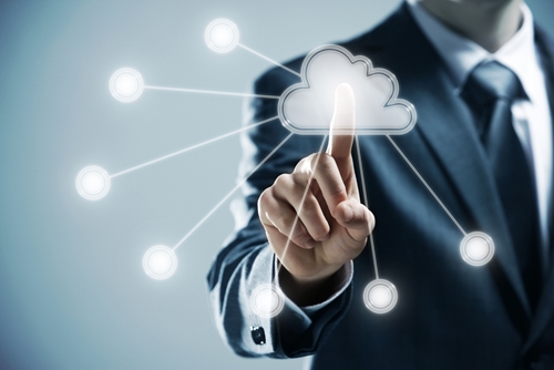 business person pointing at a cloud