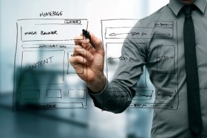 business person drawing plans for website pages