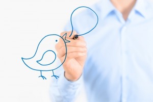 bird with speach bubble being drawn by business person