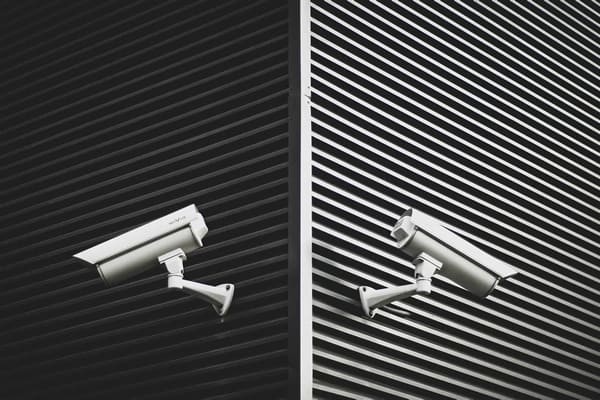 big brother concept with two security cameras on the wall