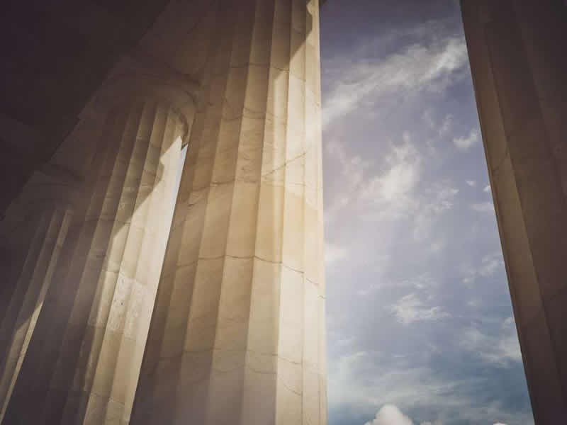 looking up at a pillar
